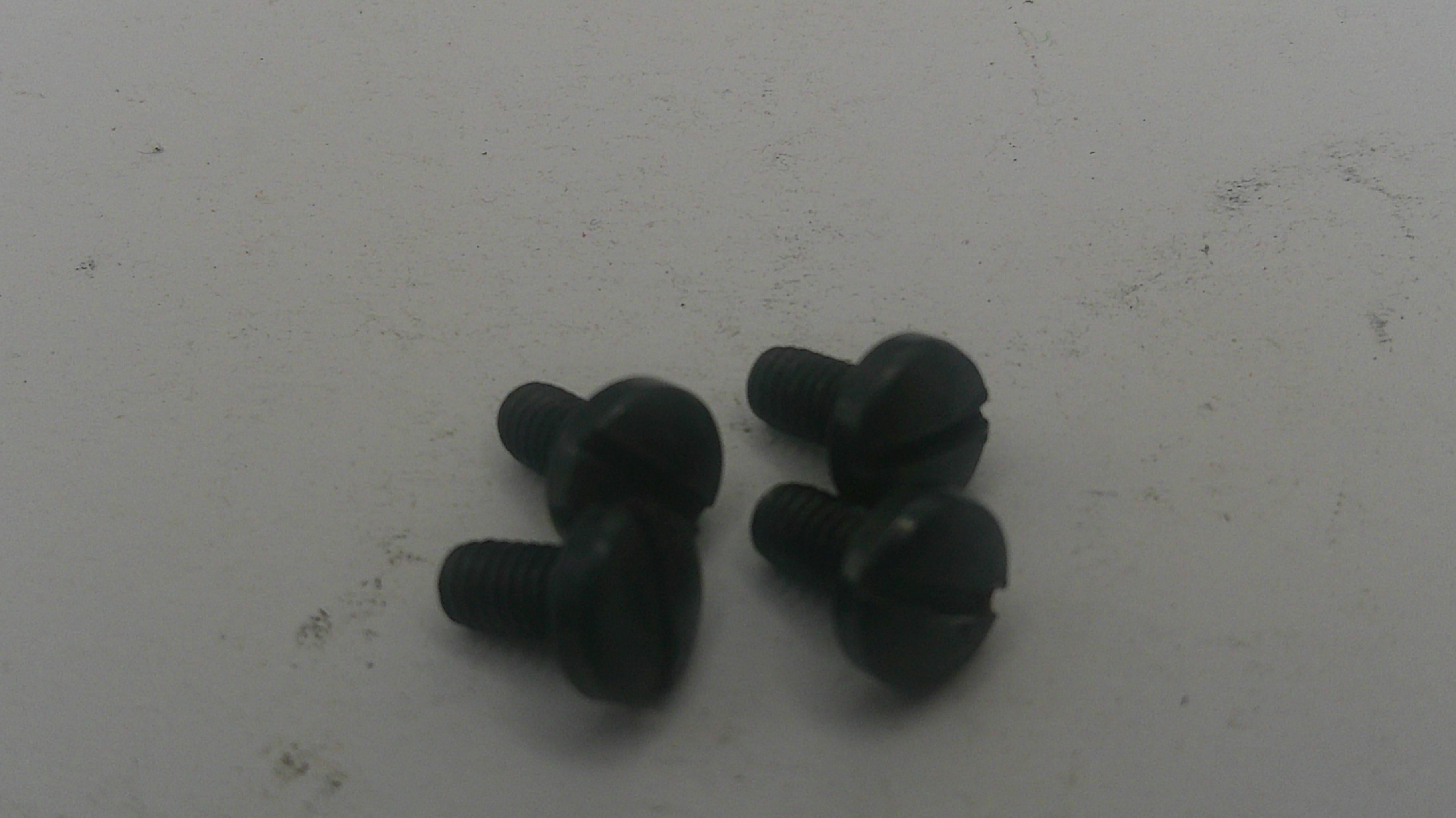 Pair of black earbuds on a white surface