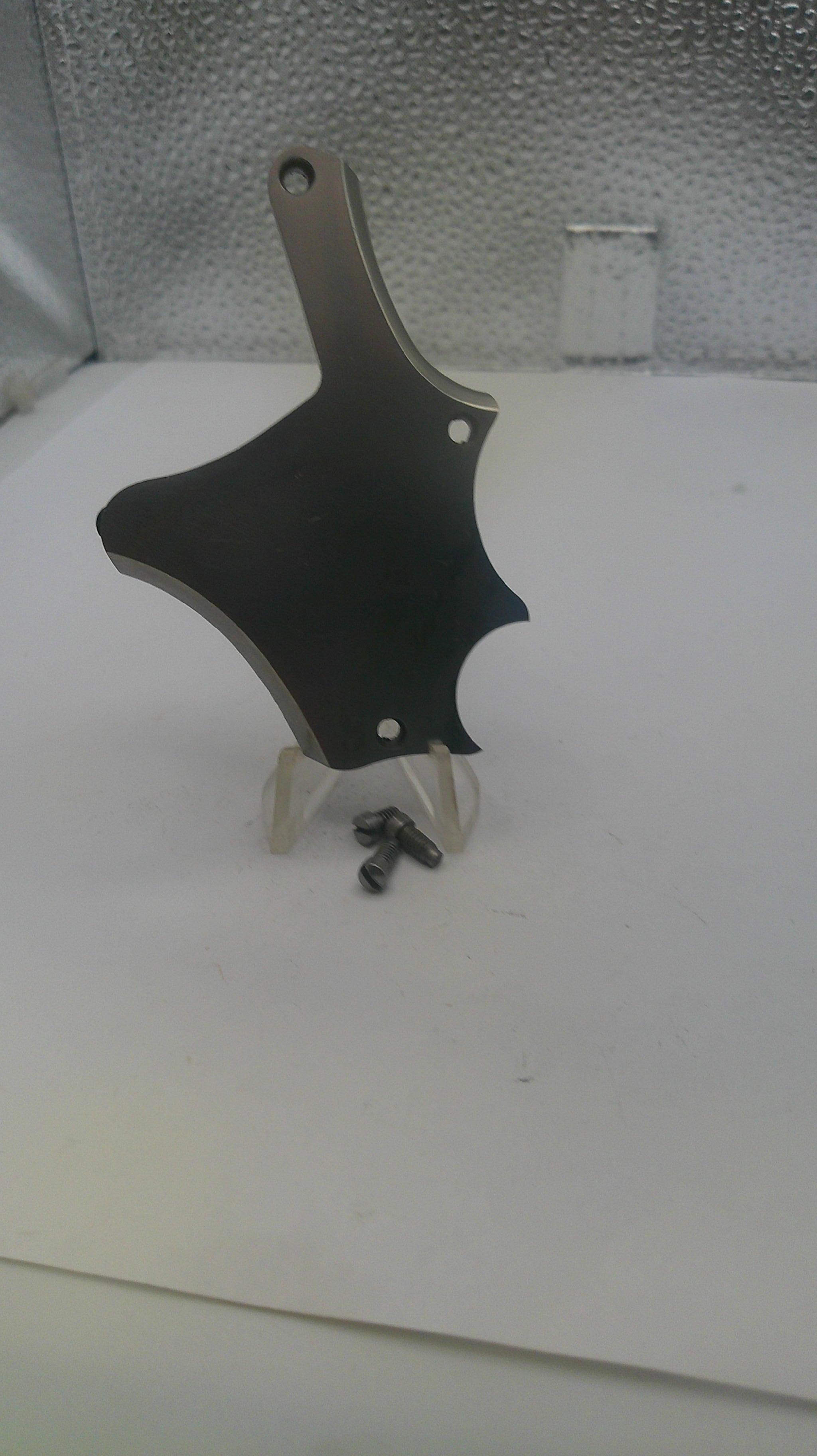 Black and silver tool on a textured white surface