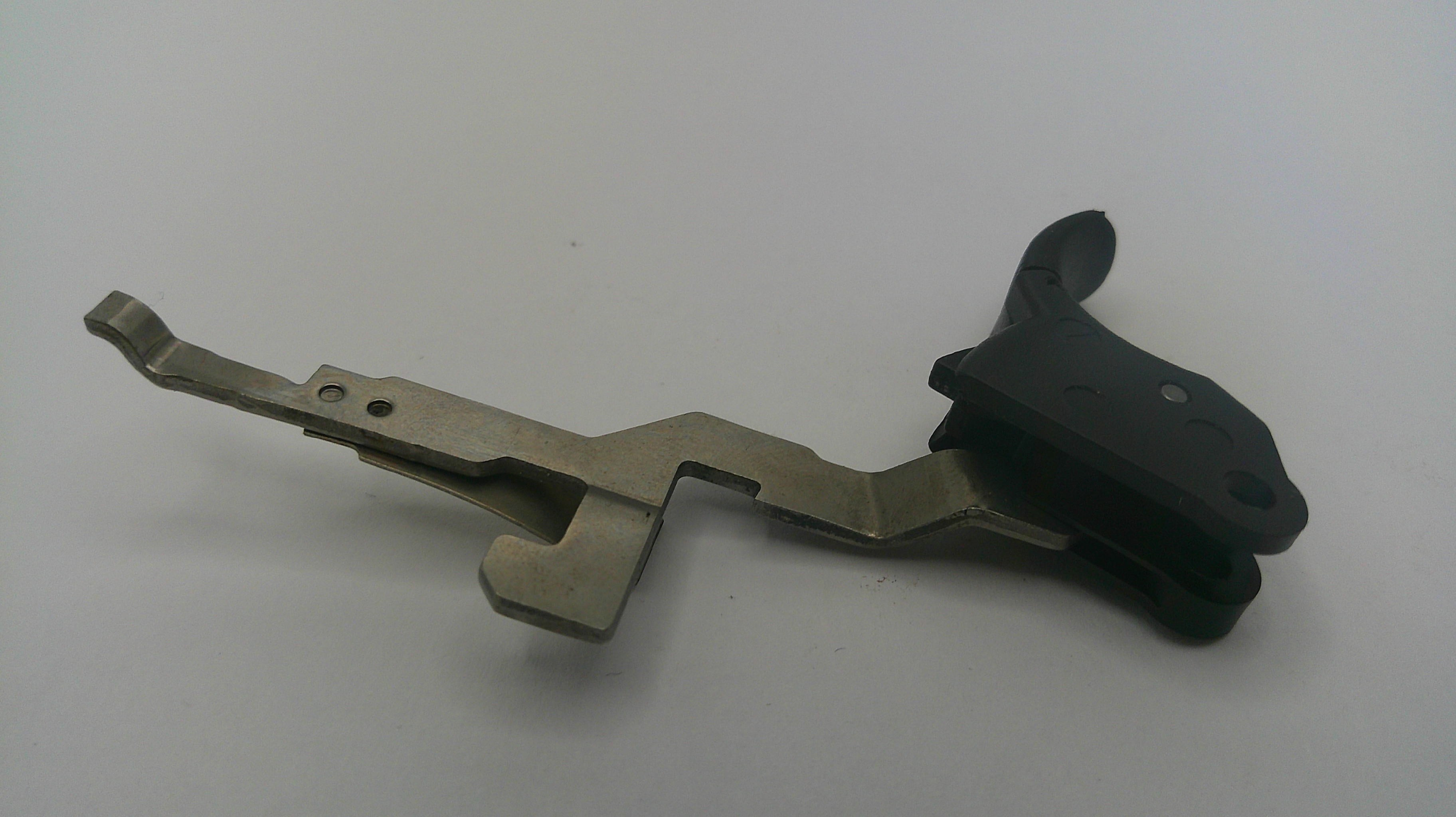 Metallic and black mechanical component on a white background