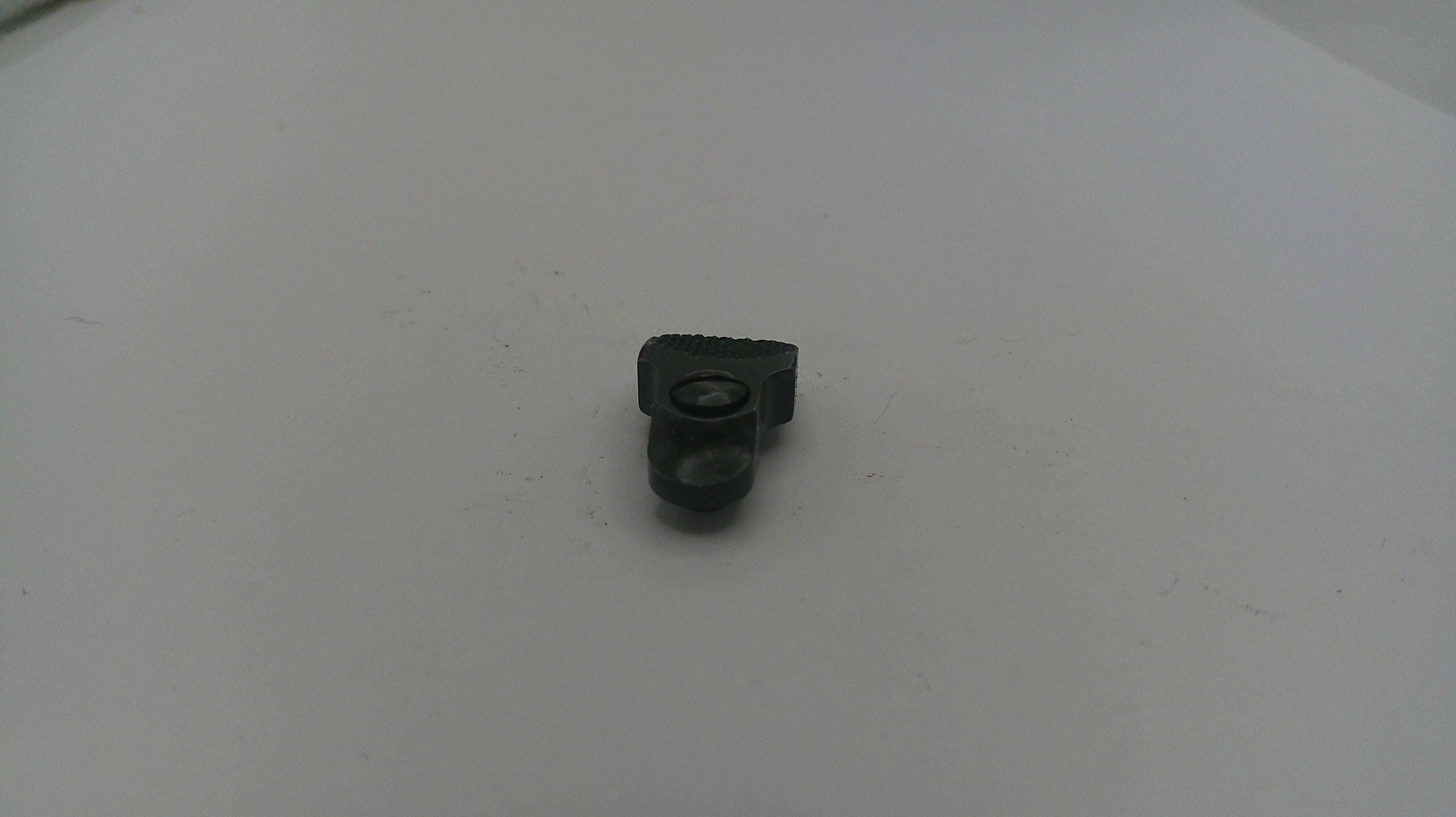 Small black object on a white surface