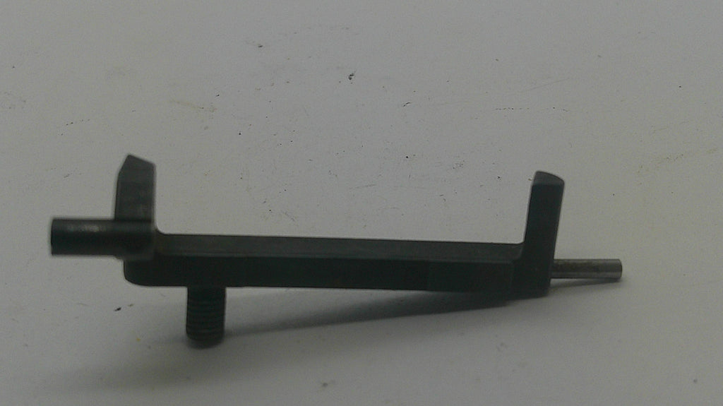 A small black metal hardware component with a flat rectangular body, two angled tabs, and a threaded rod extending from one end, photographed on a plain light background.