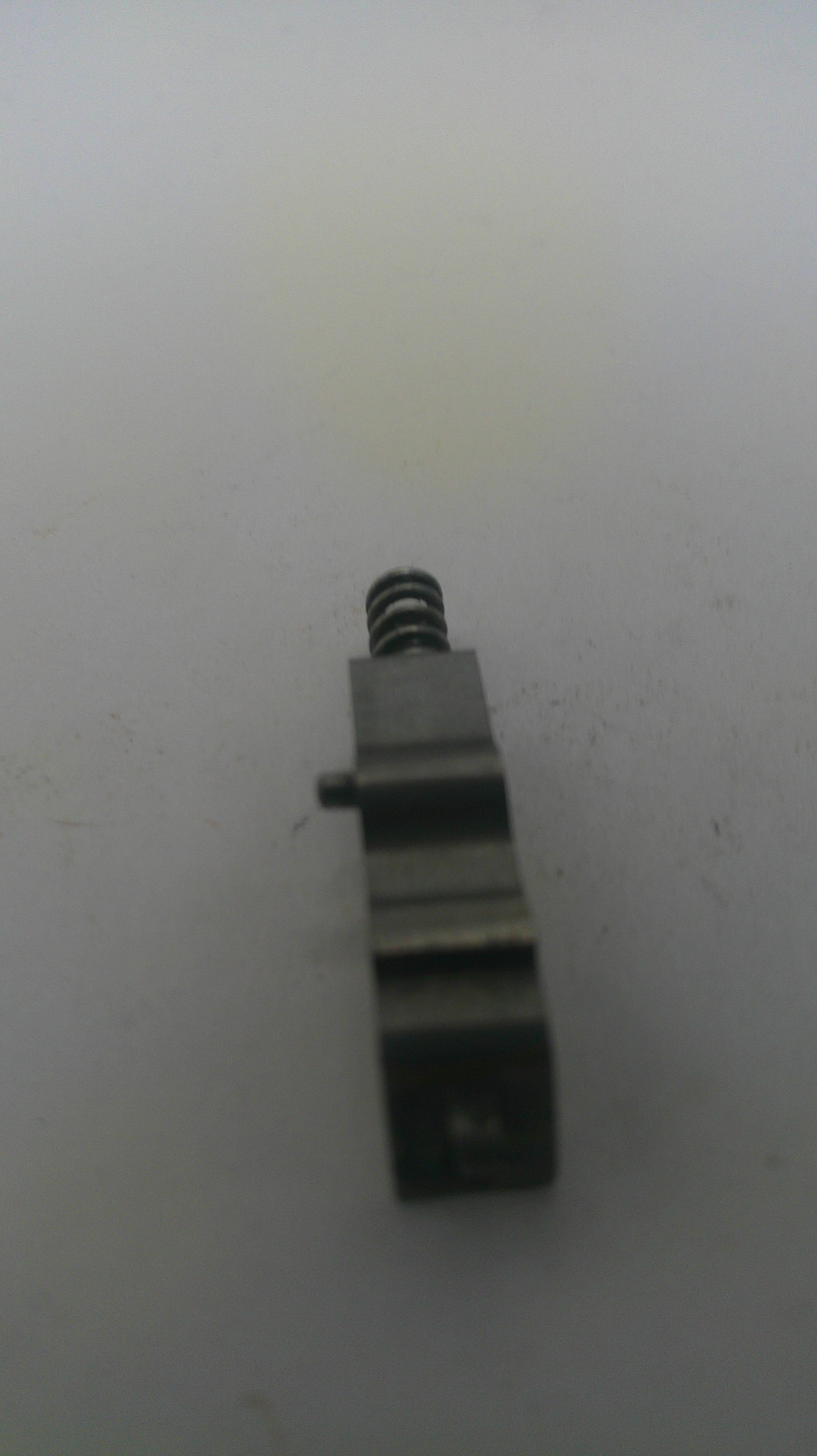 Metallic component on a white background