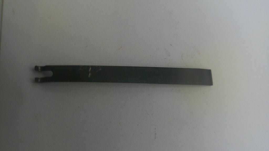 Long black metal tool on a white background