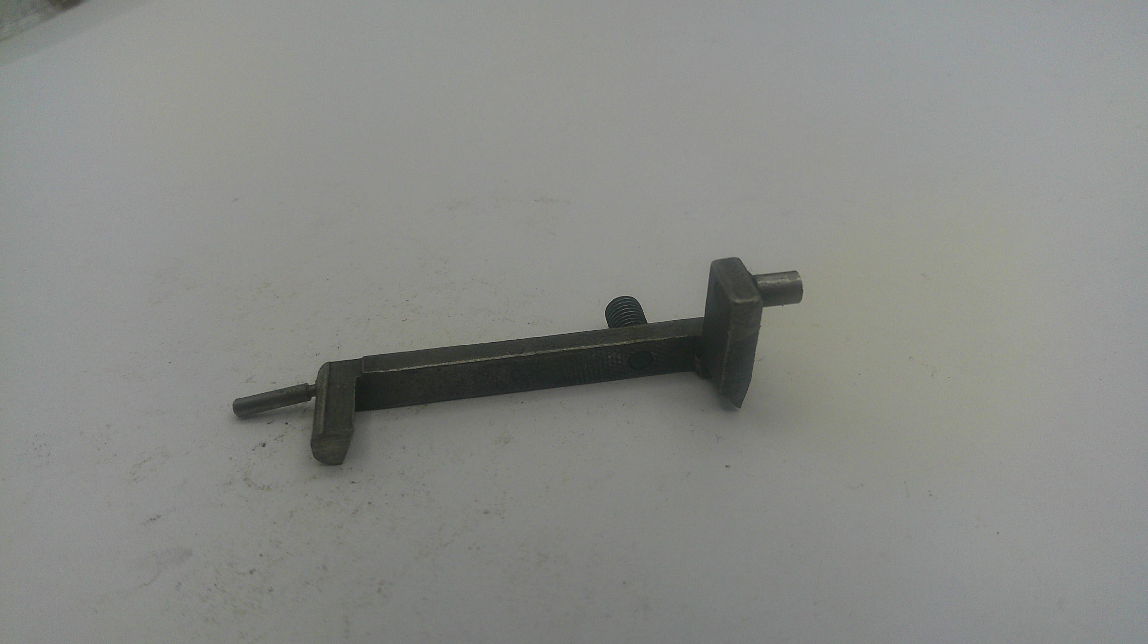 Metal tool on a white surface