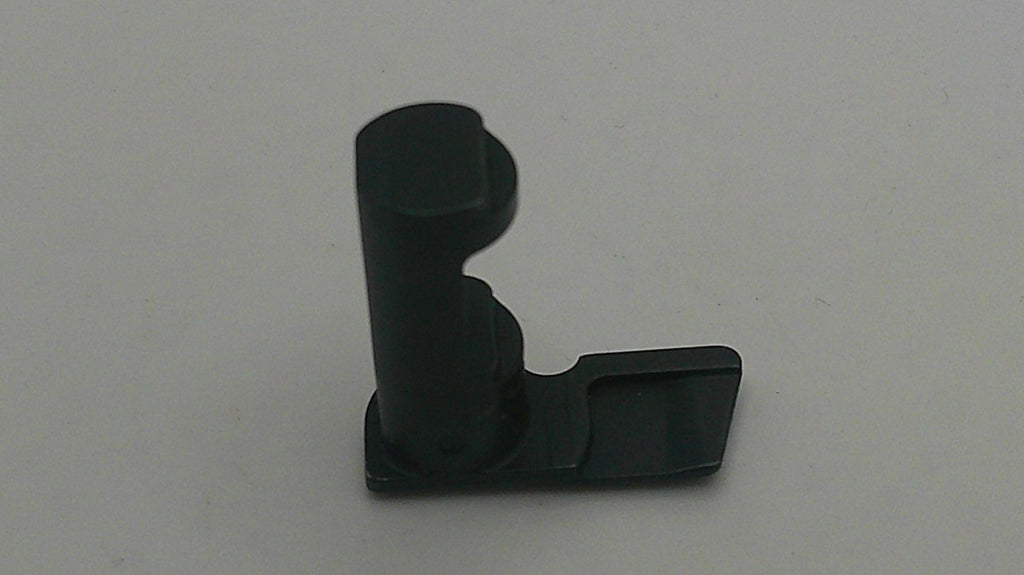 Black plastic component on a white background