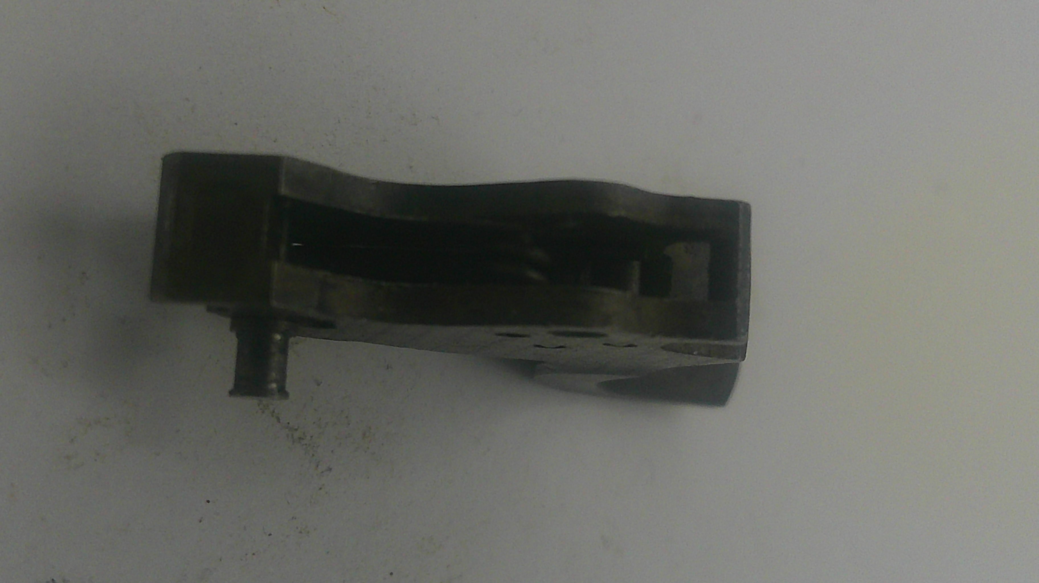 Black metal component on a white background