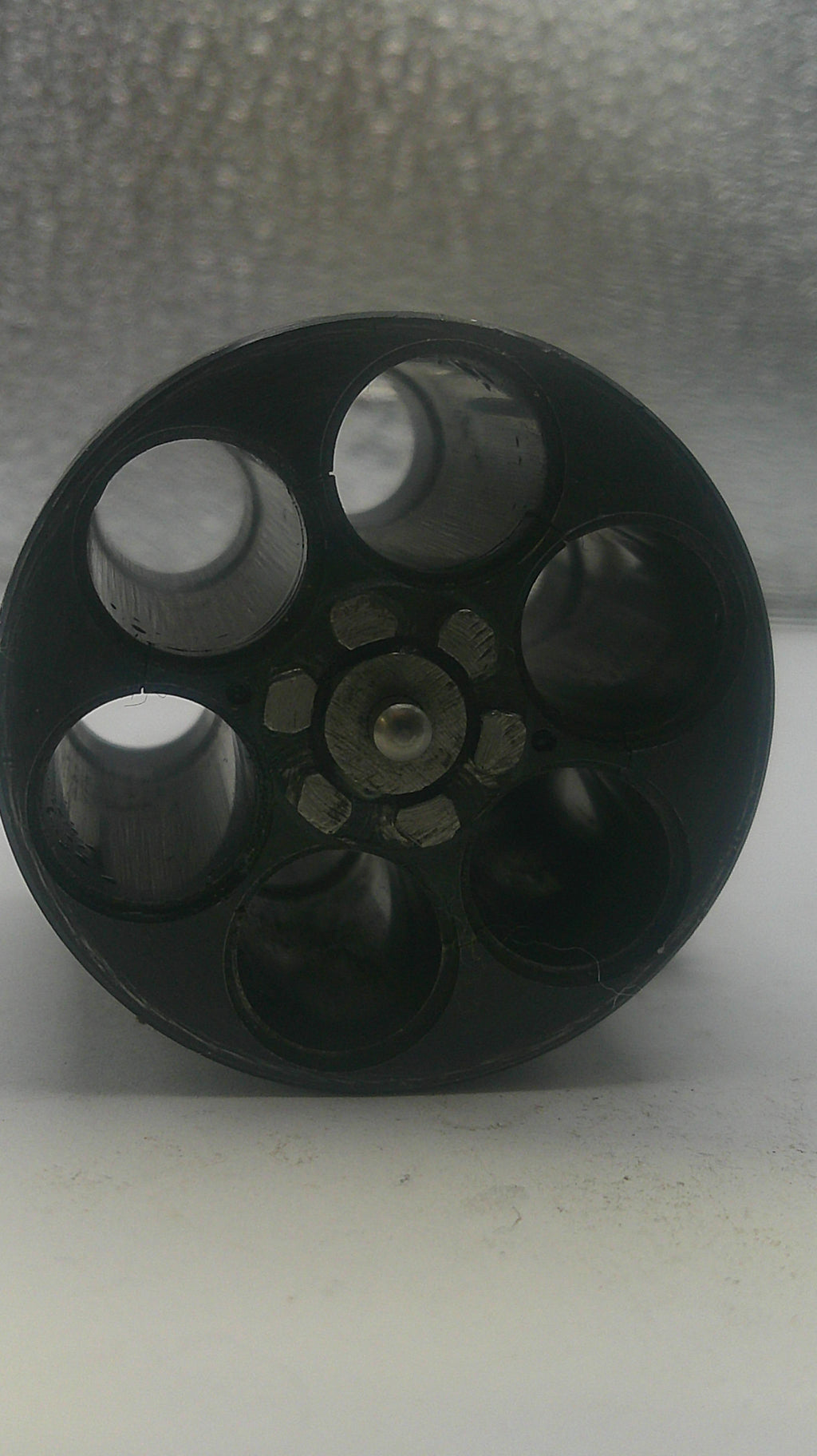 Black wheel or pulley system on a white background