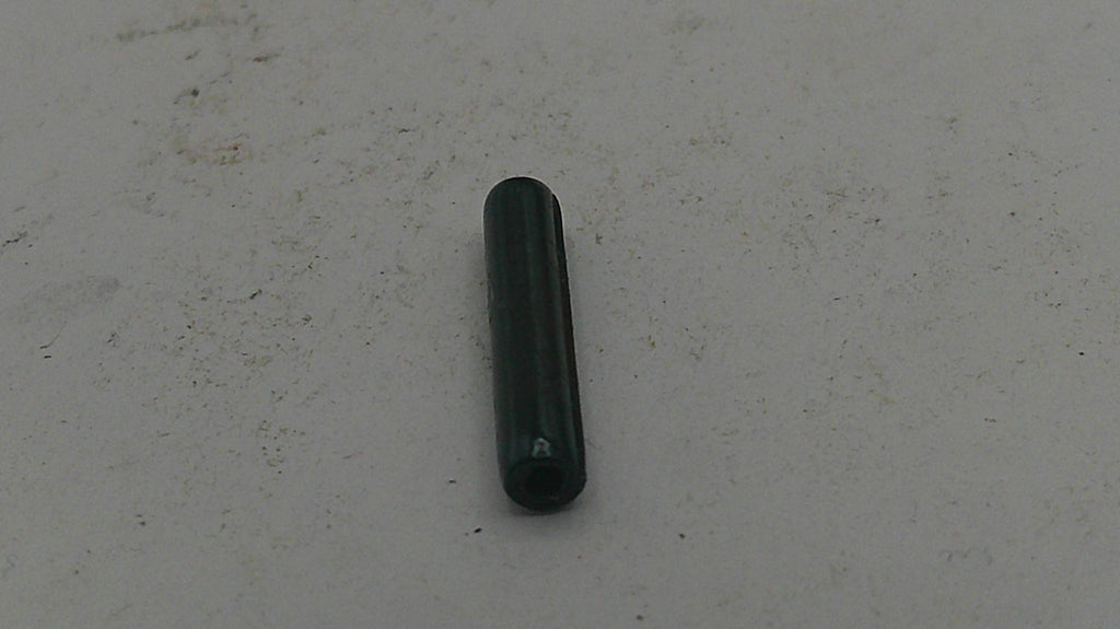 Black cylindrical object on a light gray background