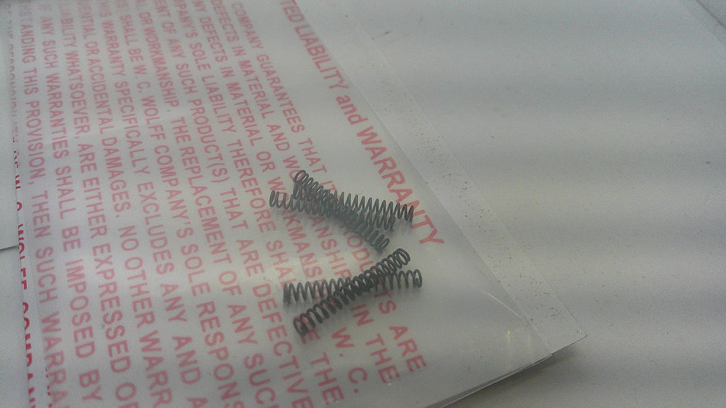 Wolff reduced power magazine catch springs for Smith & Wesson centerfire semi-automatics Part 27185, springs on packaging