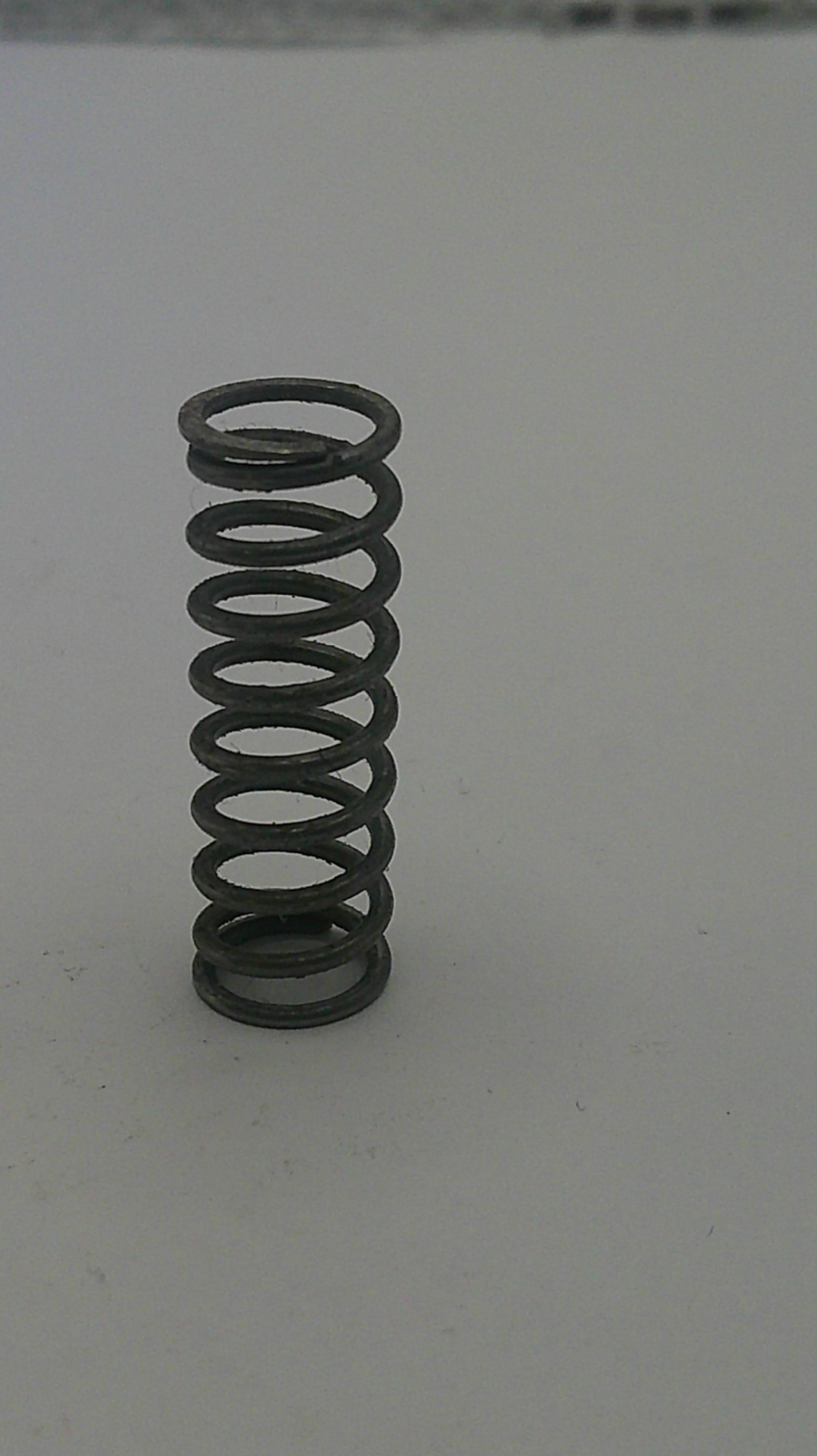 Coiled spring on a white background