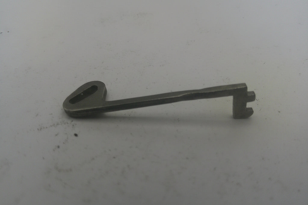 Metal key on a white background