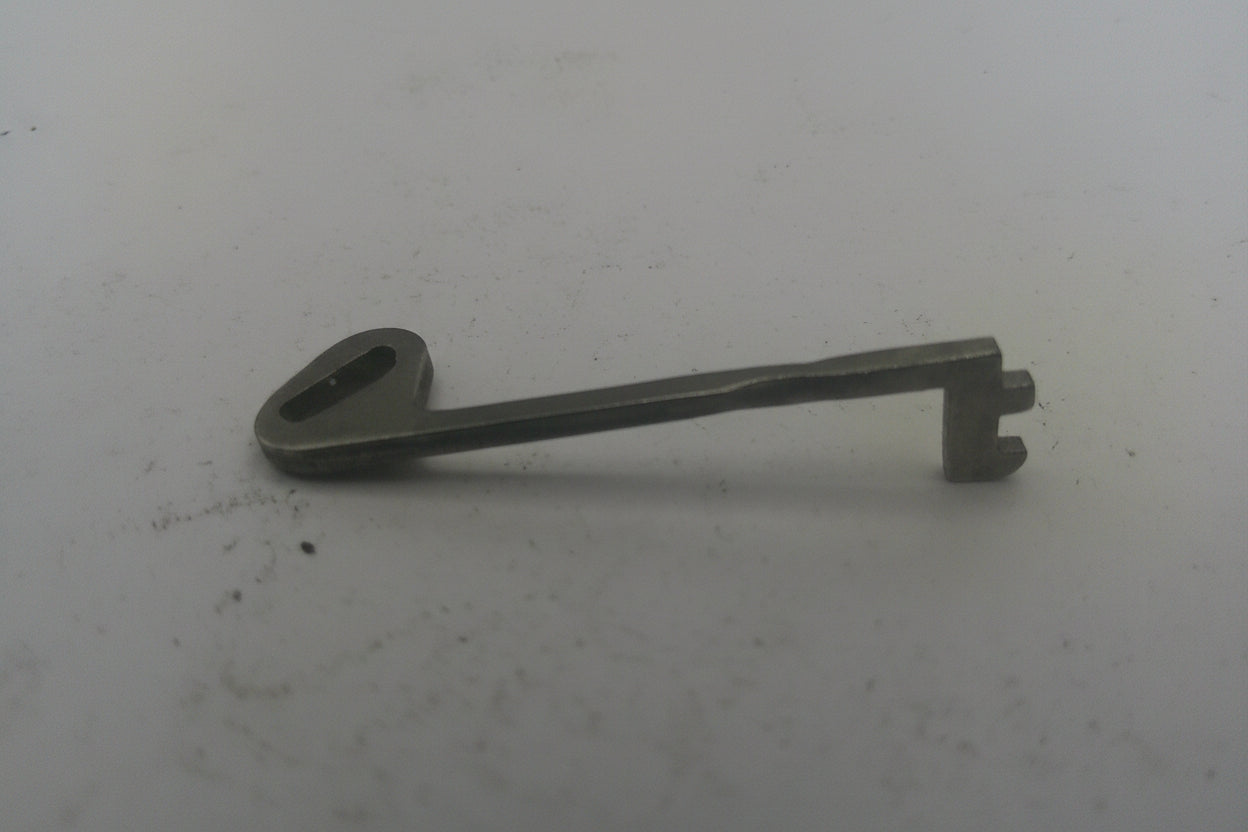 Metal key on a white background