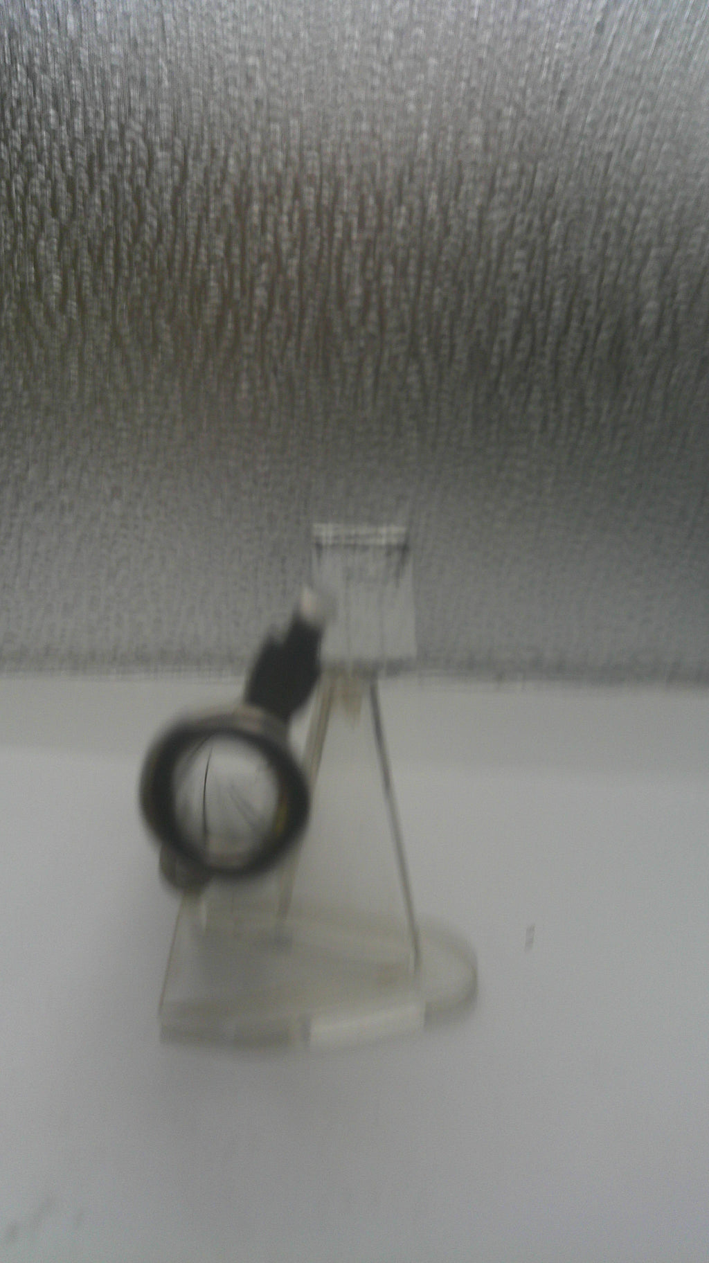 Small vacuum cleaner on a textured gray surface