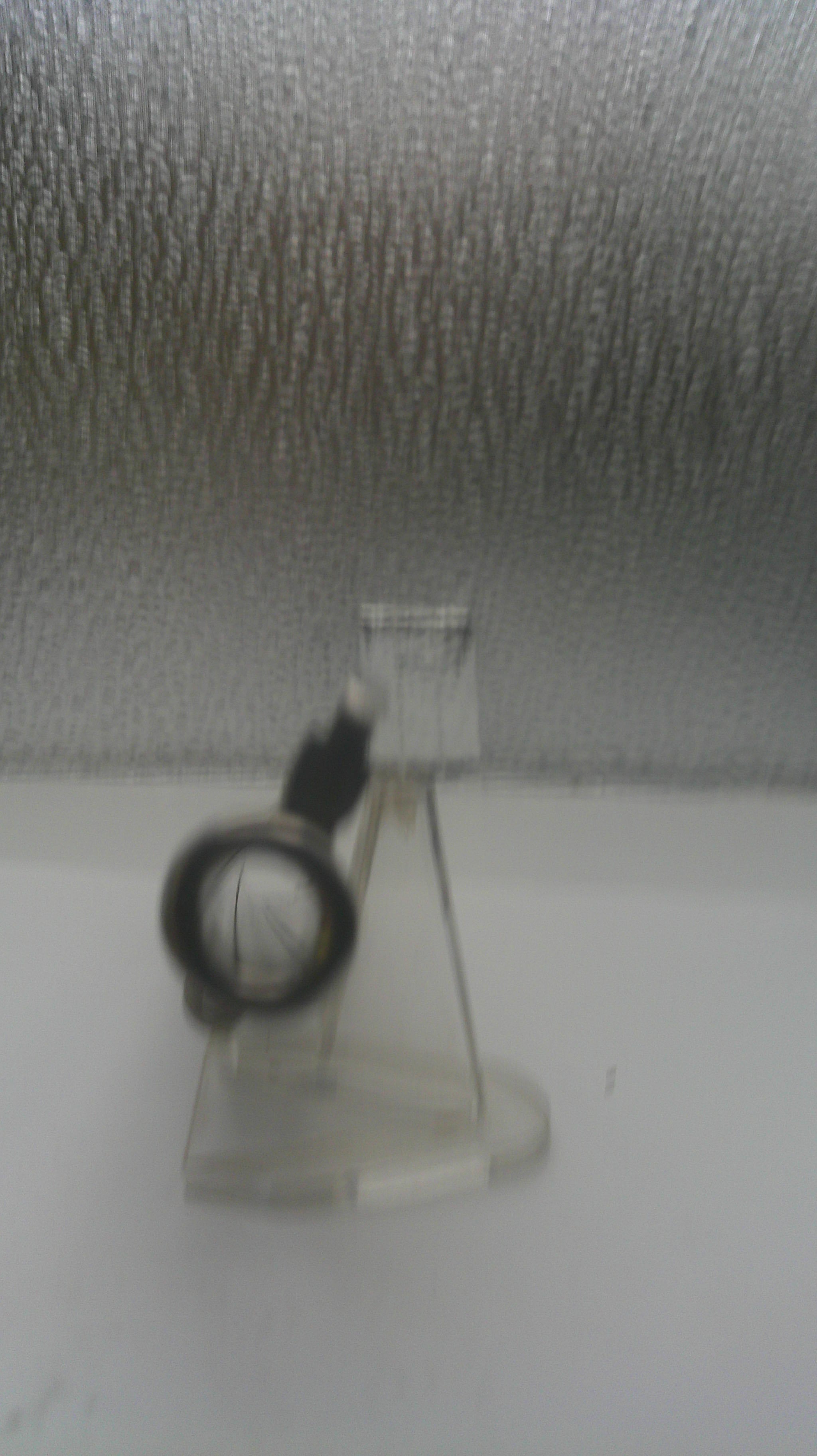 Small vacuum cleaner on a textured gray surface