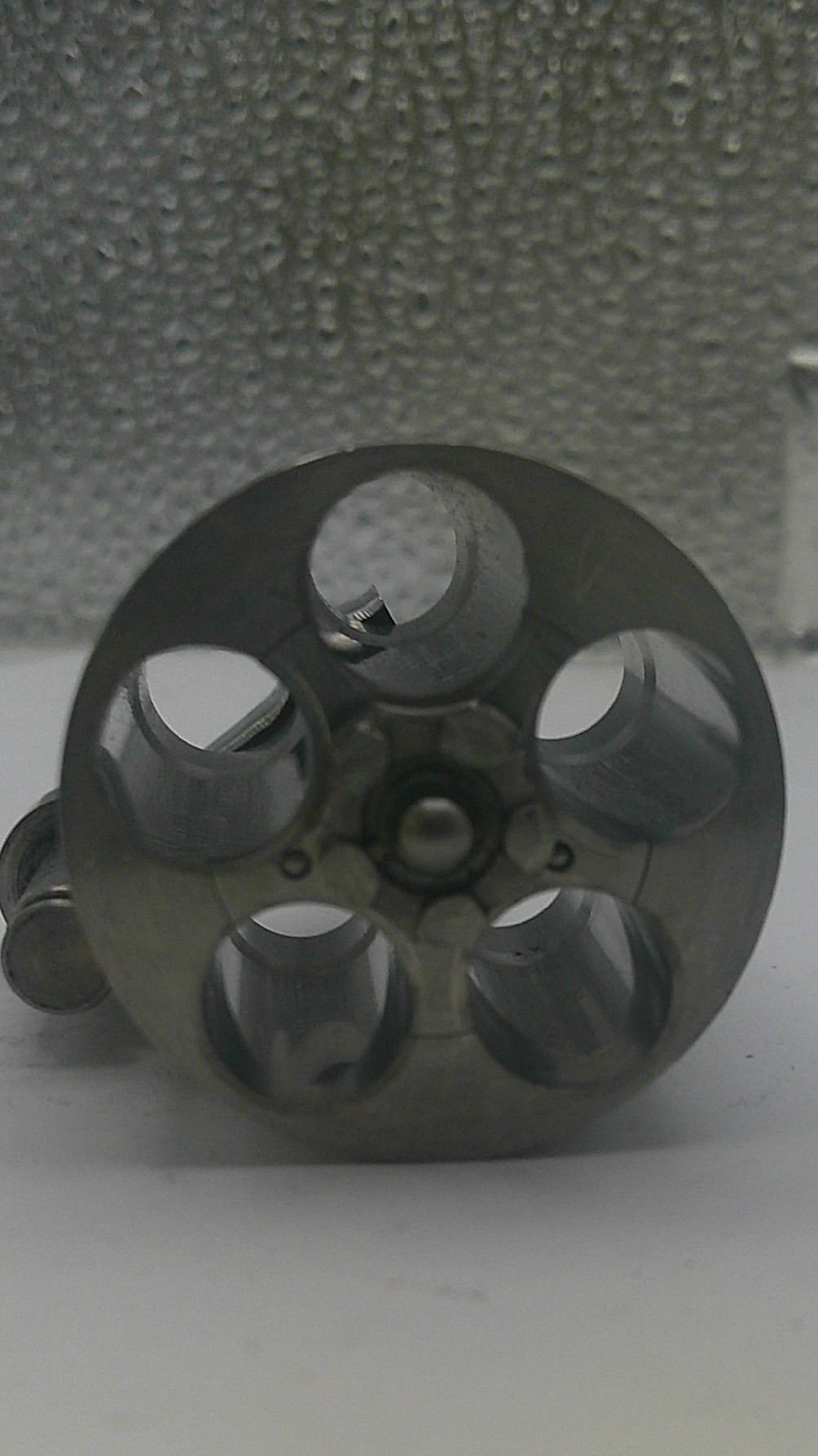 Metal pulley system attached to a textured wall