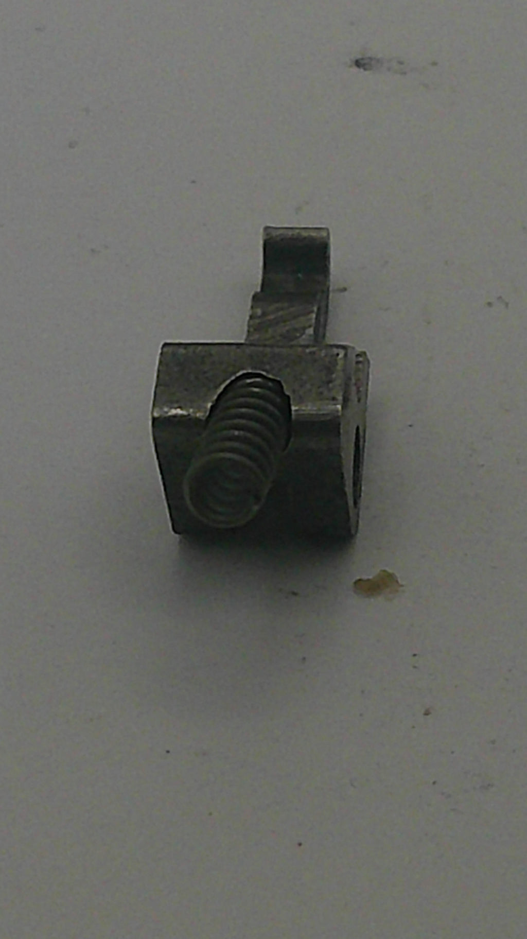 Metal bolt on a gray background