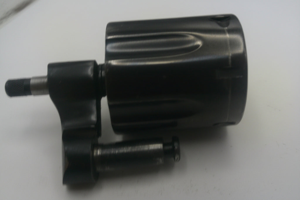 Black mechanical component on a white background