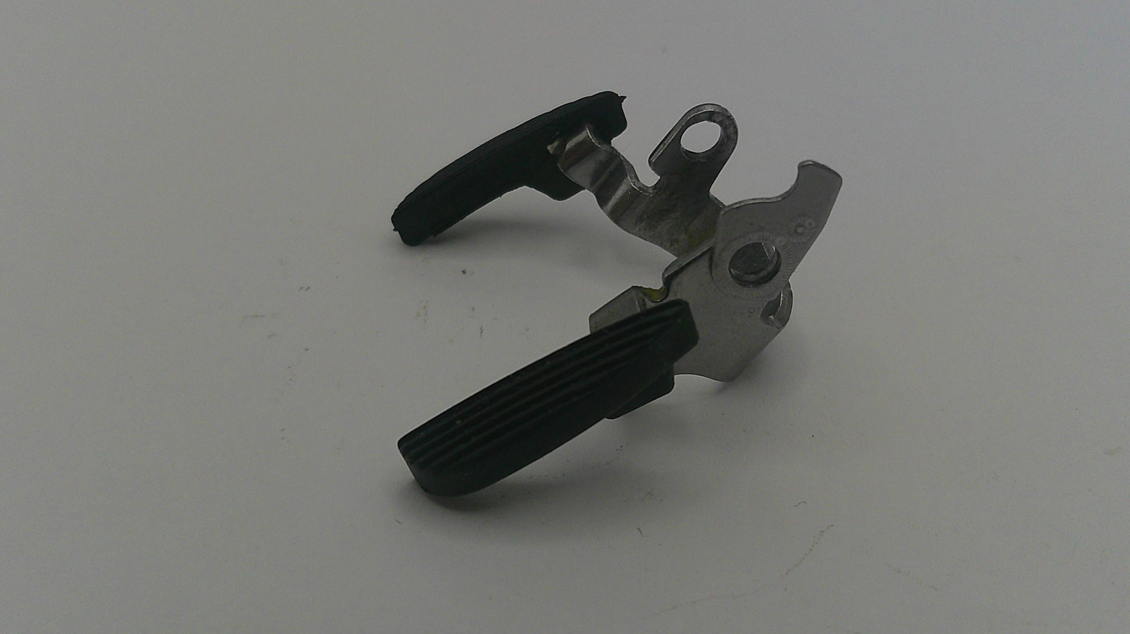 Metal and black lever mechanism on a white background