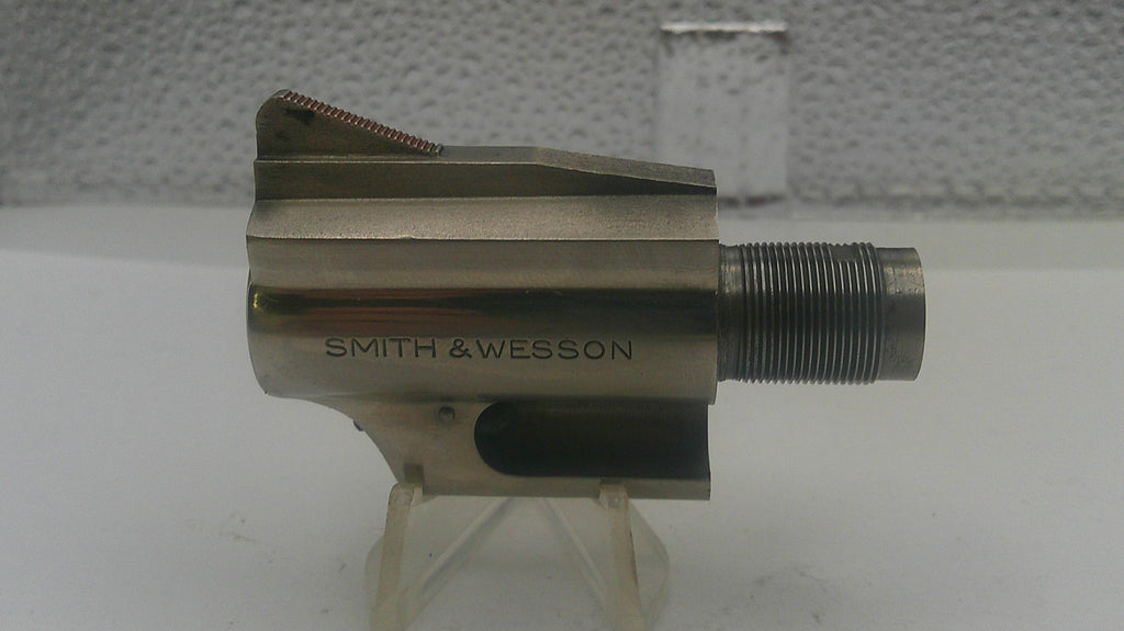 Metal component with 'Smith & Wesson' branding on a white background