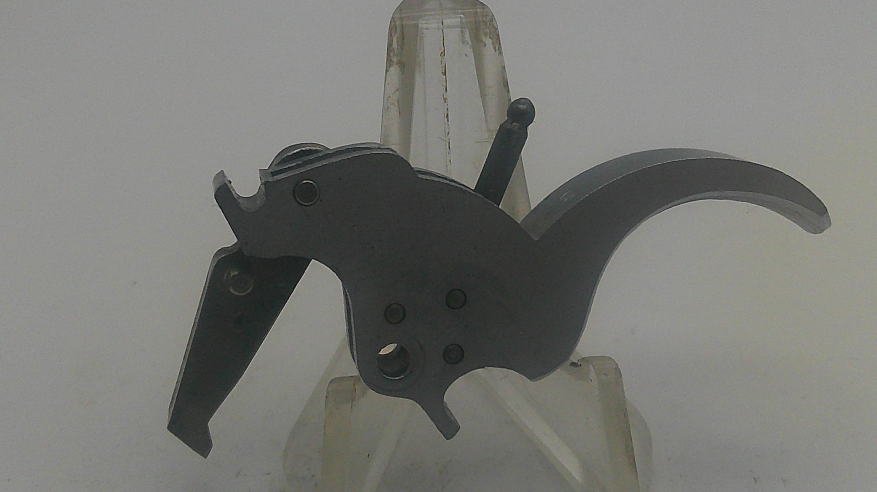 Black mechanical component on a white background