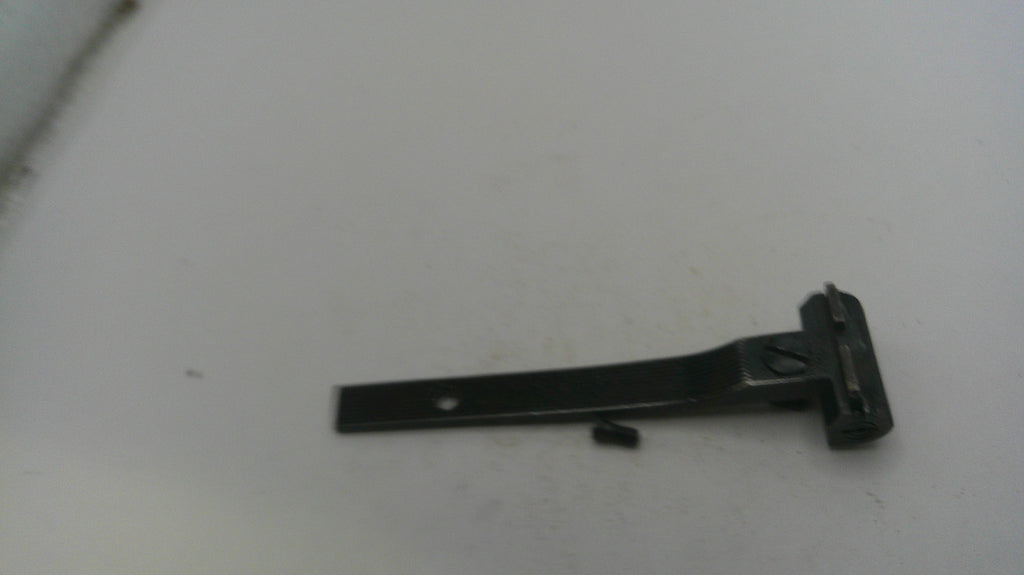 Black metal bracket on a white surface