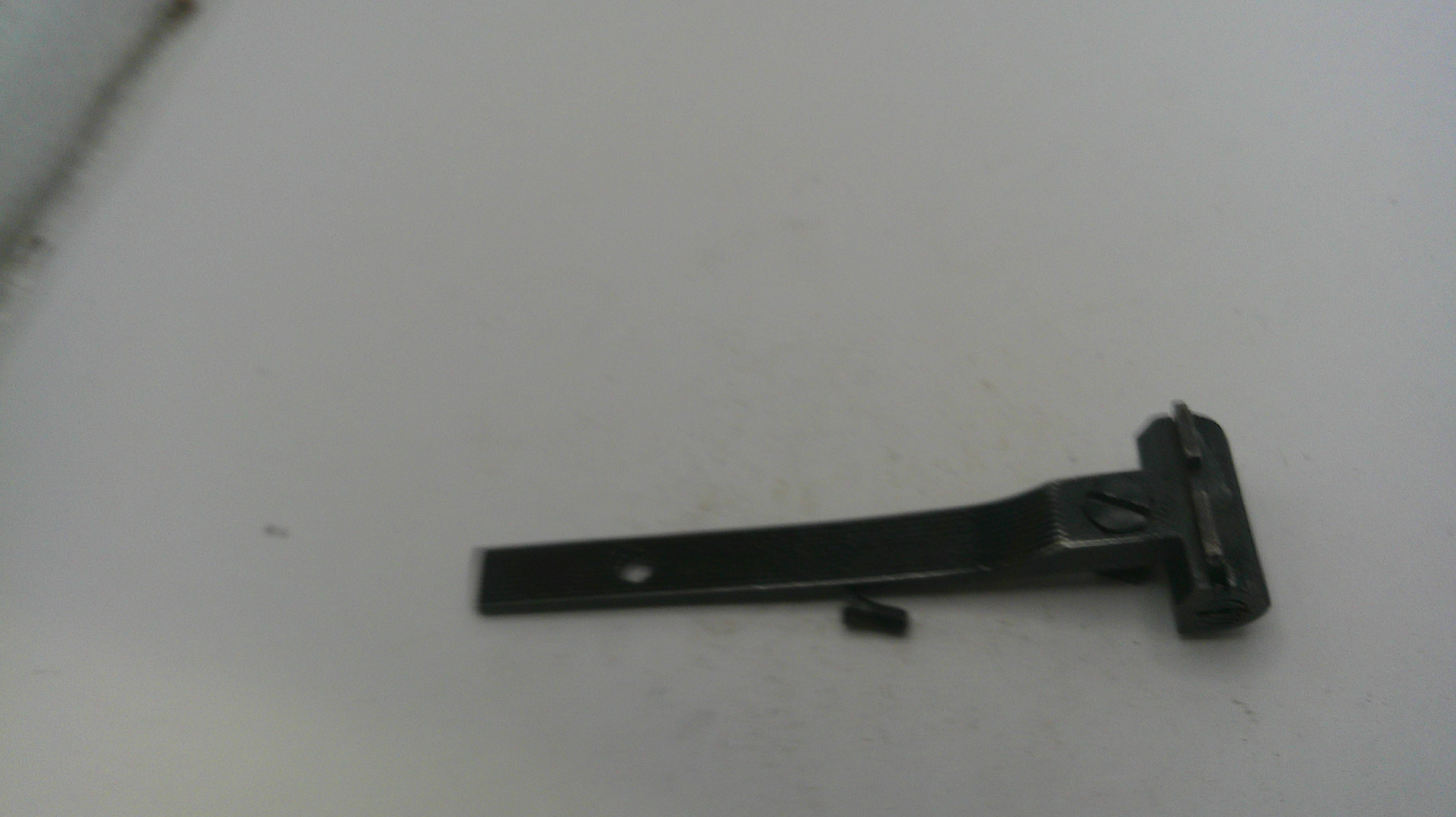 Black metal bracket on a white surface