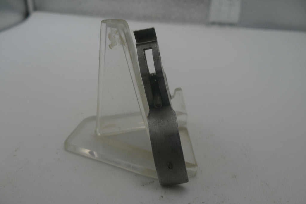 Metallic handle on a textured white surface