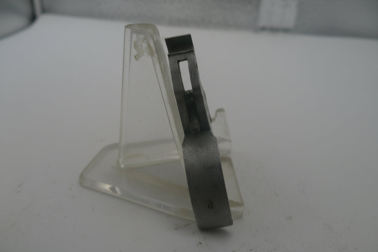 Metallic handle on a textured white surface