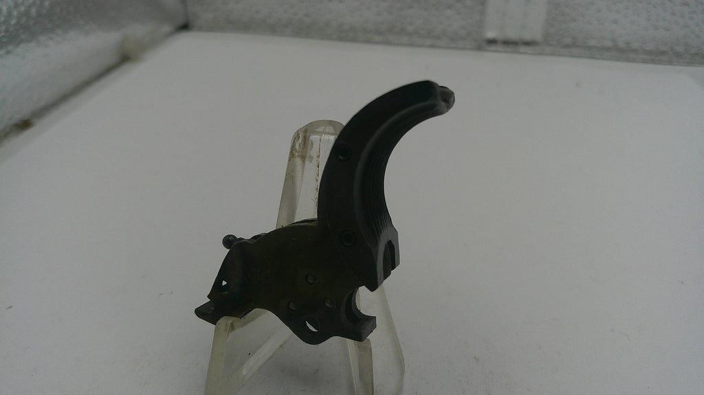 Black archery bow nock on a white surface