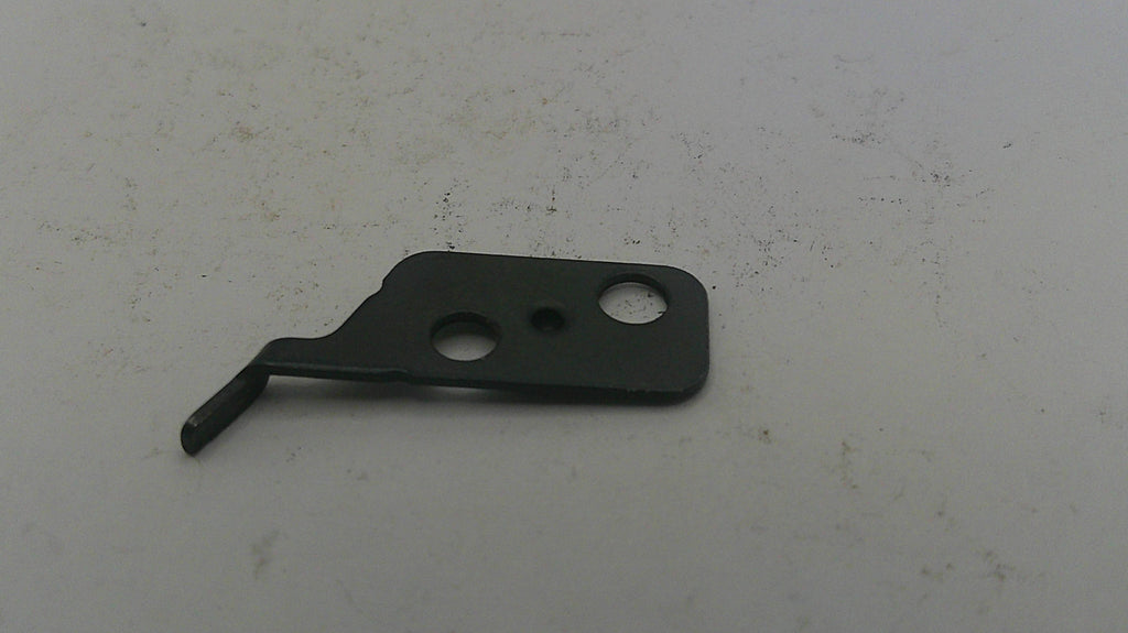 Metallic component on a textured white background