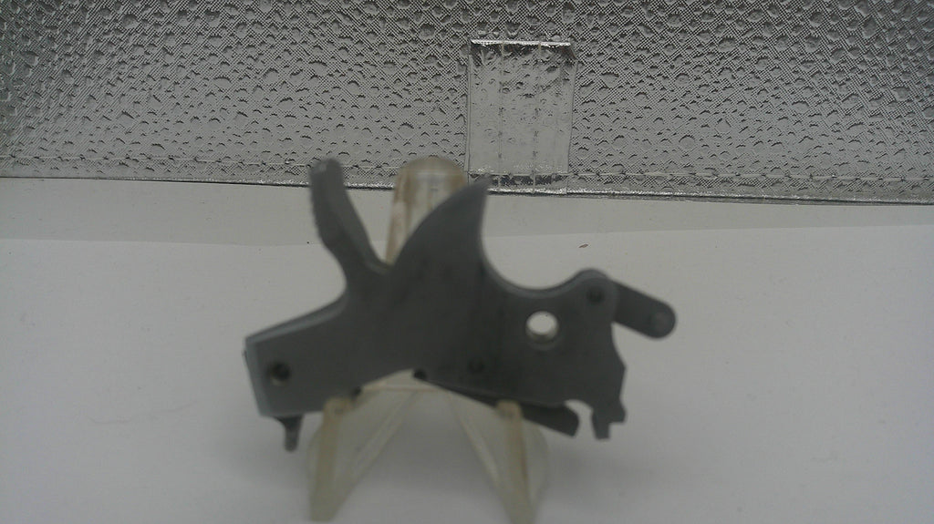 Mechanical component on a stand against a textured wall background