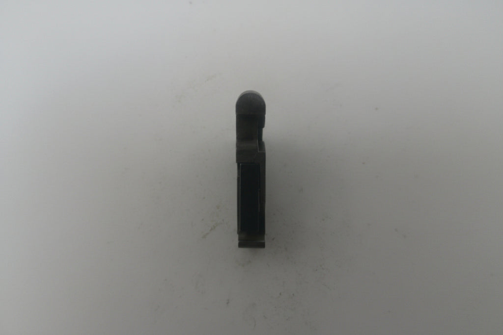 Black cylindrical object on a white background