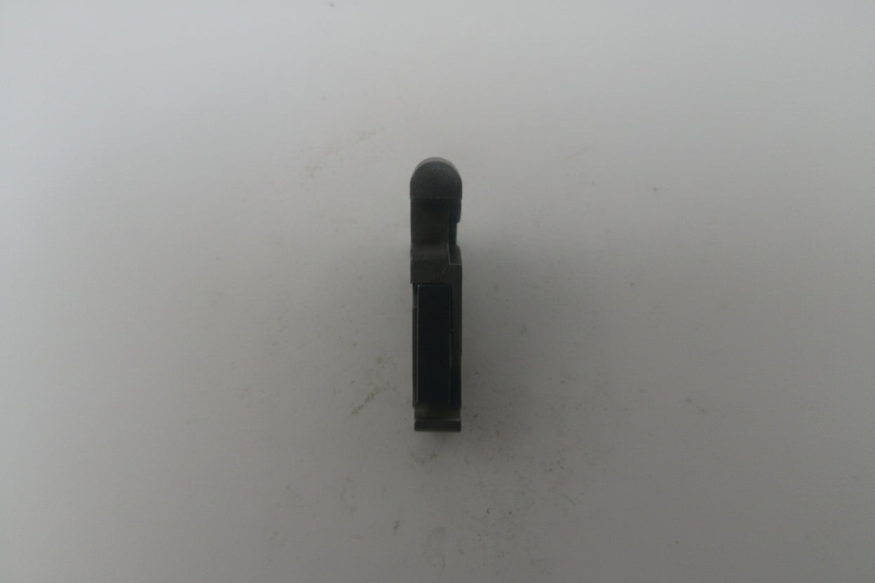 Black cylindrical object on a white background