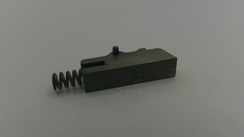 Black metal component with a spring on a white background