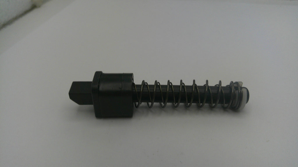 Black mechanical component with spring on a white background