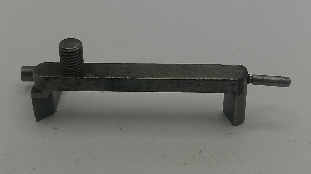 Metal tool or component on a gray background