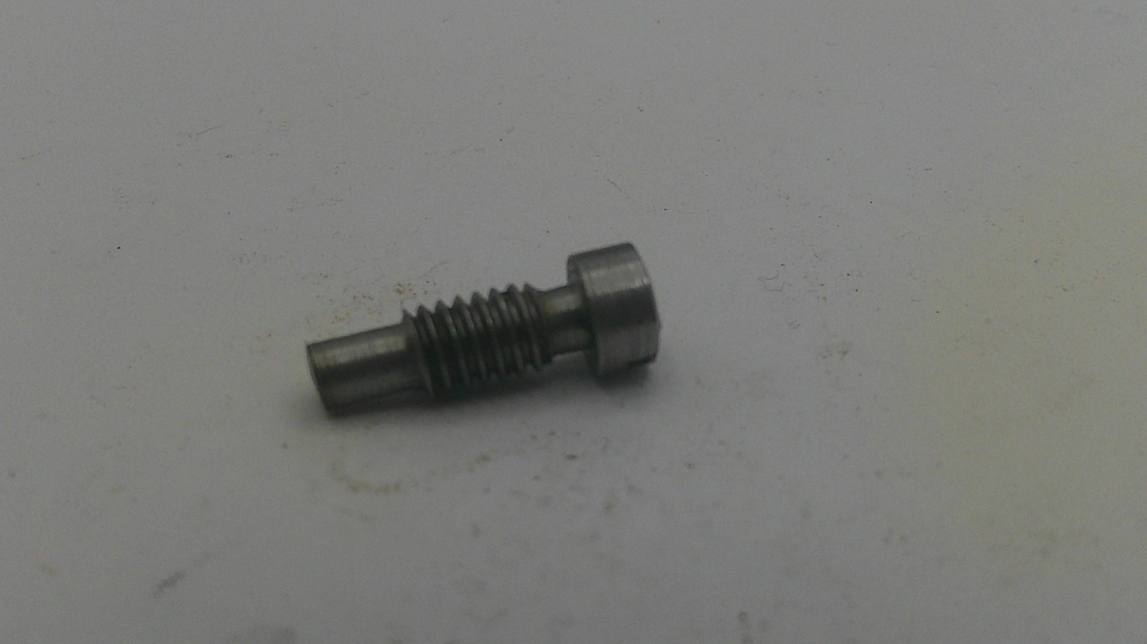 Metal screw on a light gray background