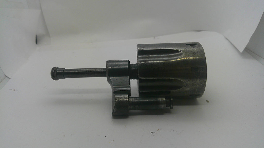 A used dark metallic mechanical part, possibly a tool component or motor assembly, photographed on a white background.