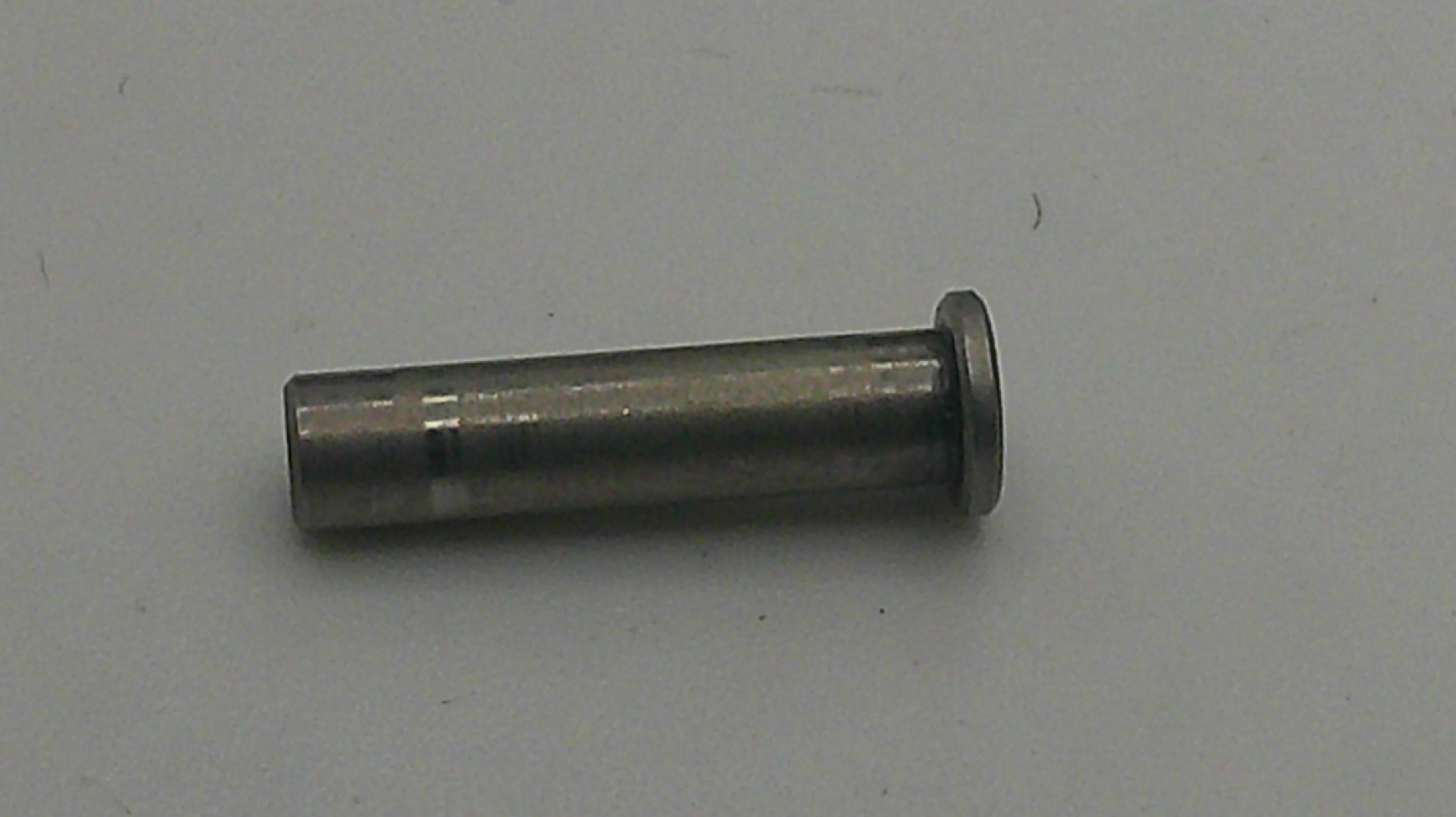 Metal cylindrical object on a gray background