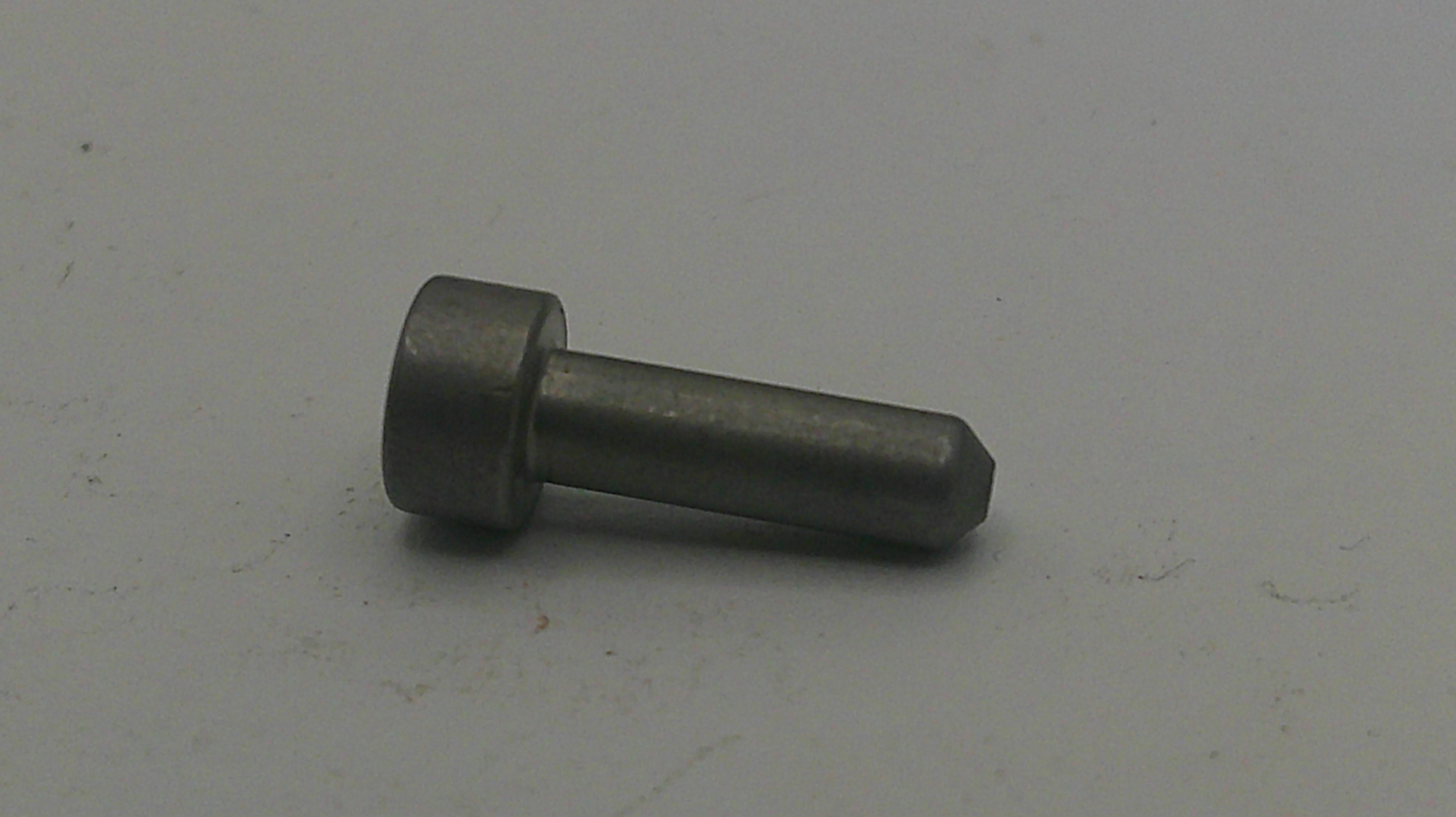Metal screw on a light gray background