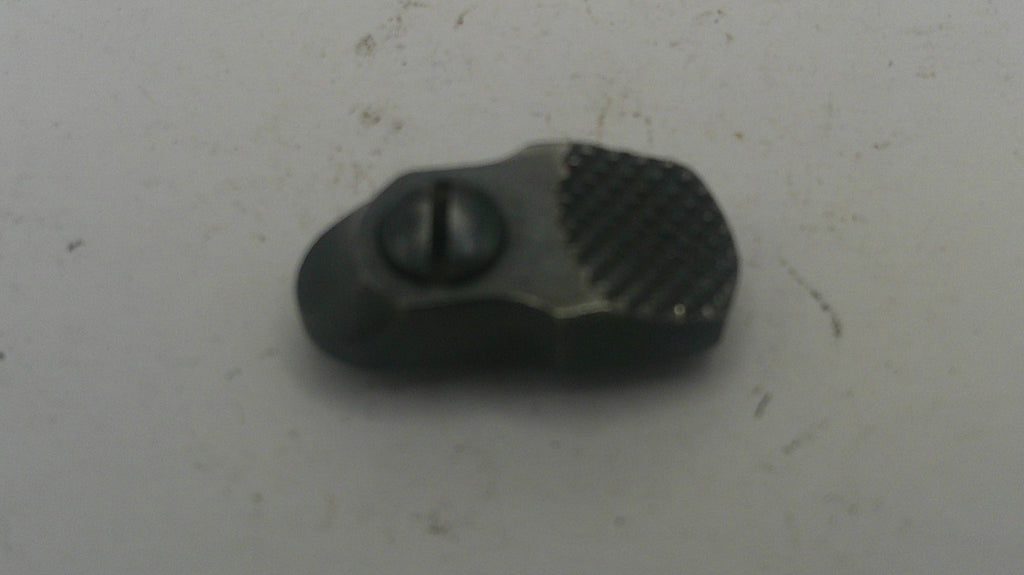 Black plastic component on a light gray background