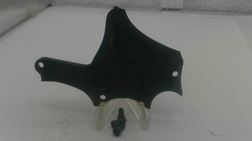 Black motorcycle fairing on a white stand with a white background
