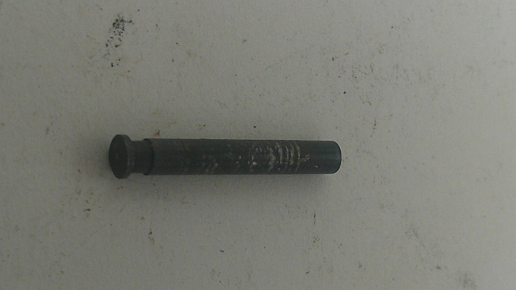 Black metal bolt on a light gray background
