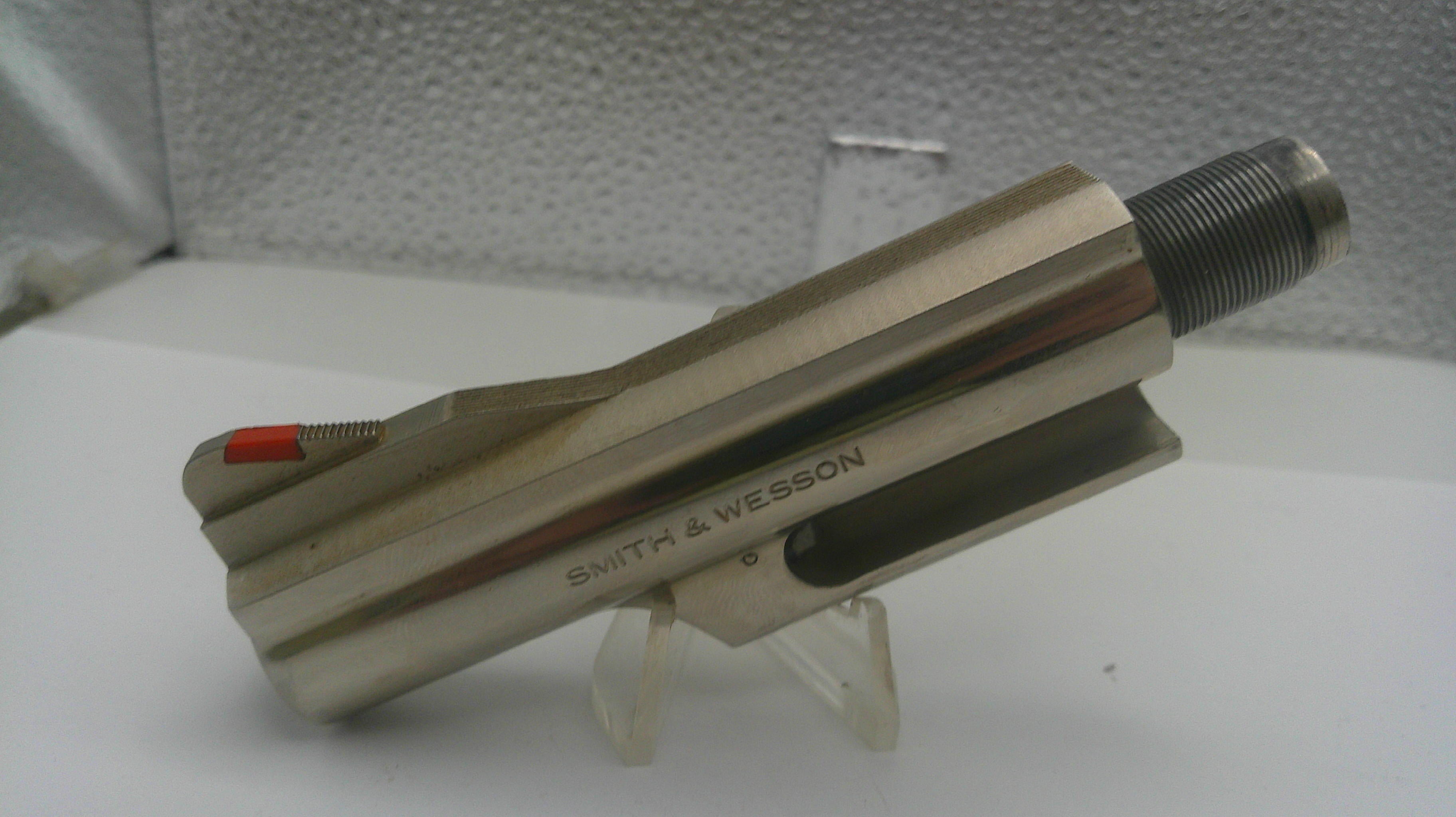 Smith & Wesson firearm barrel on a stand with a white background
