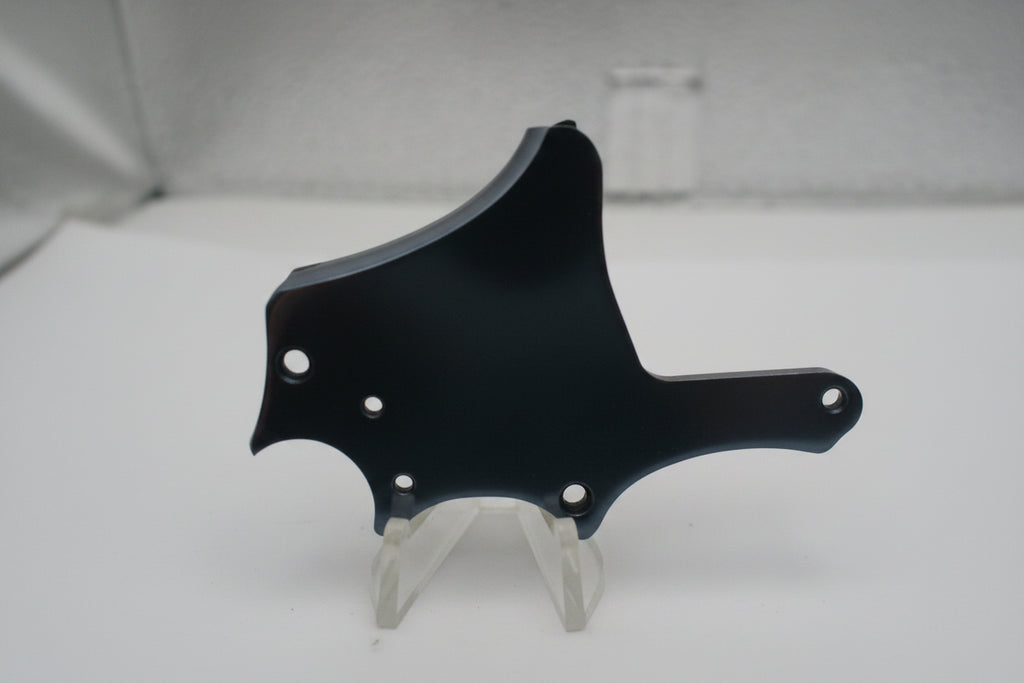 Blurred black object on a white surface