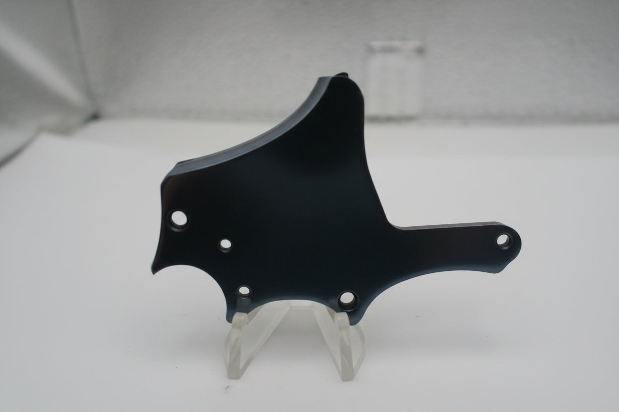 Blurred black object on a white surface