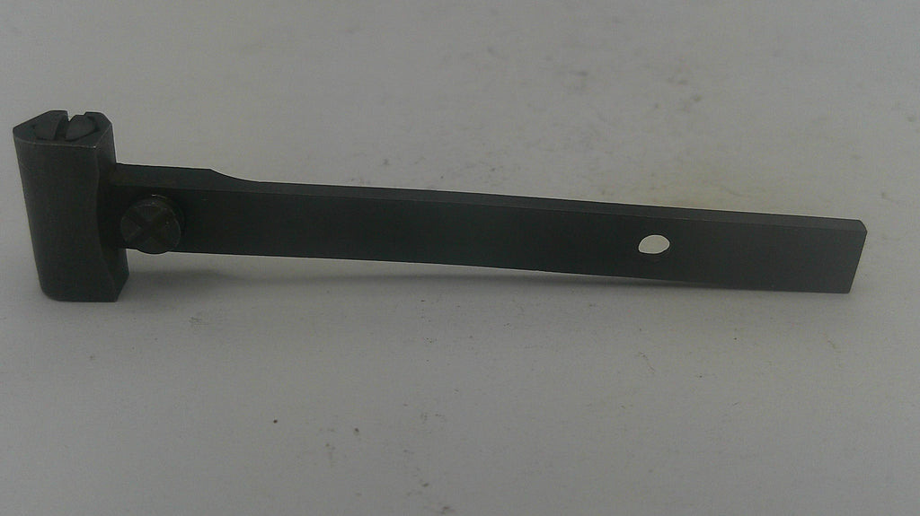 A black metal hardware bracket or latch piece with a rectangular base, a short stem, and a circular hole near the end, photographed on a plain light background.