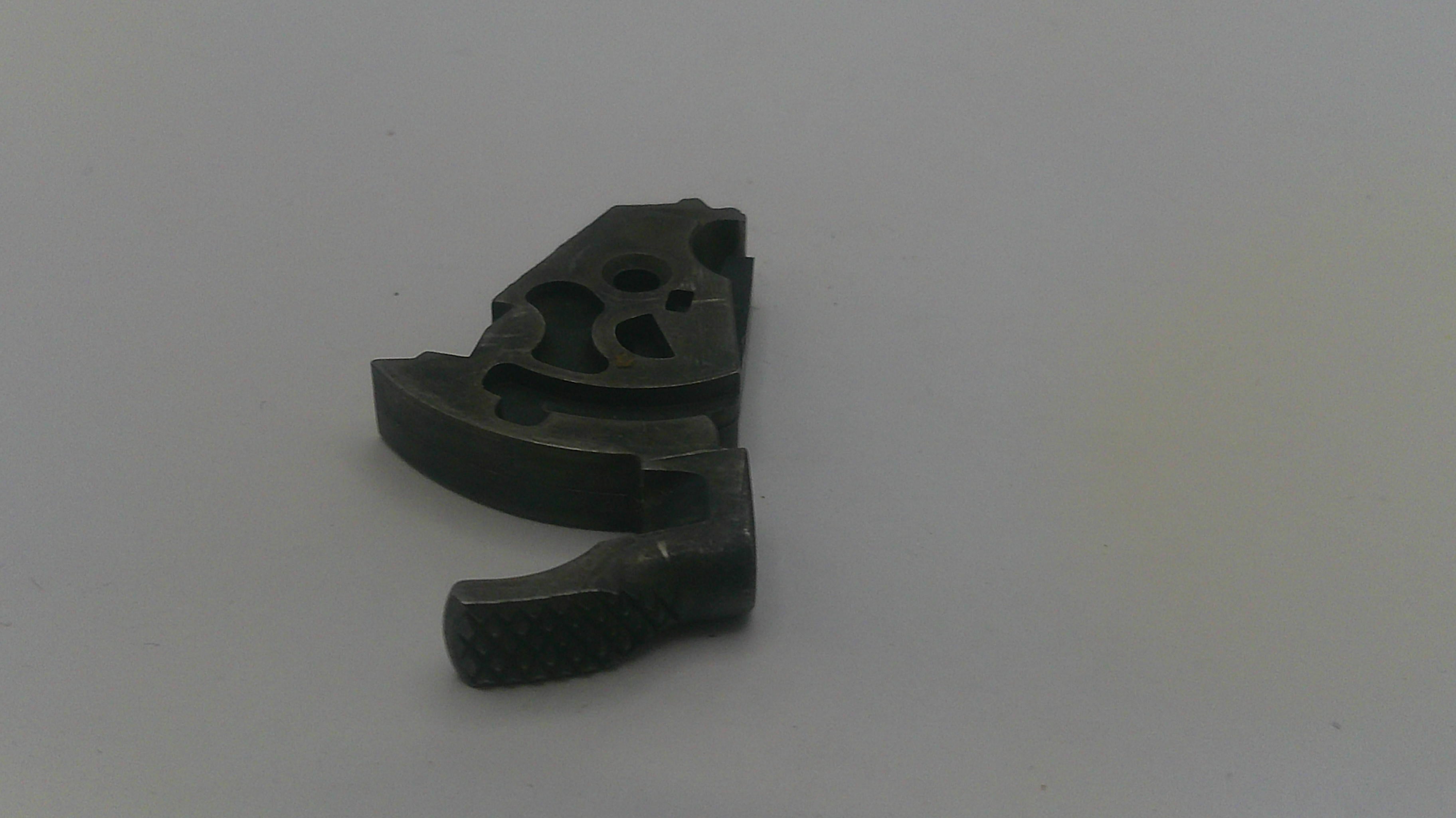 Black metal mechanical component on a white background