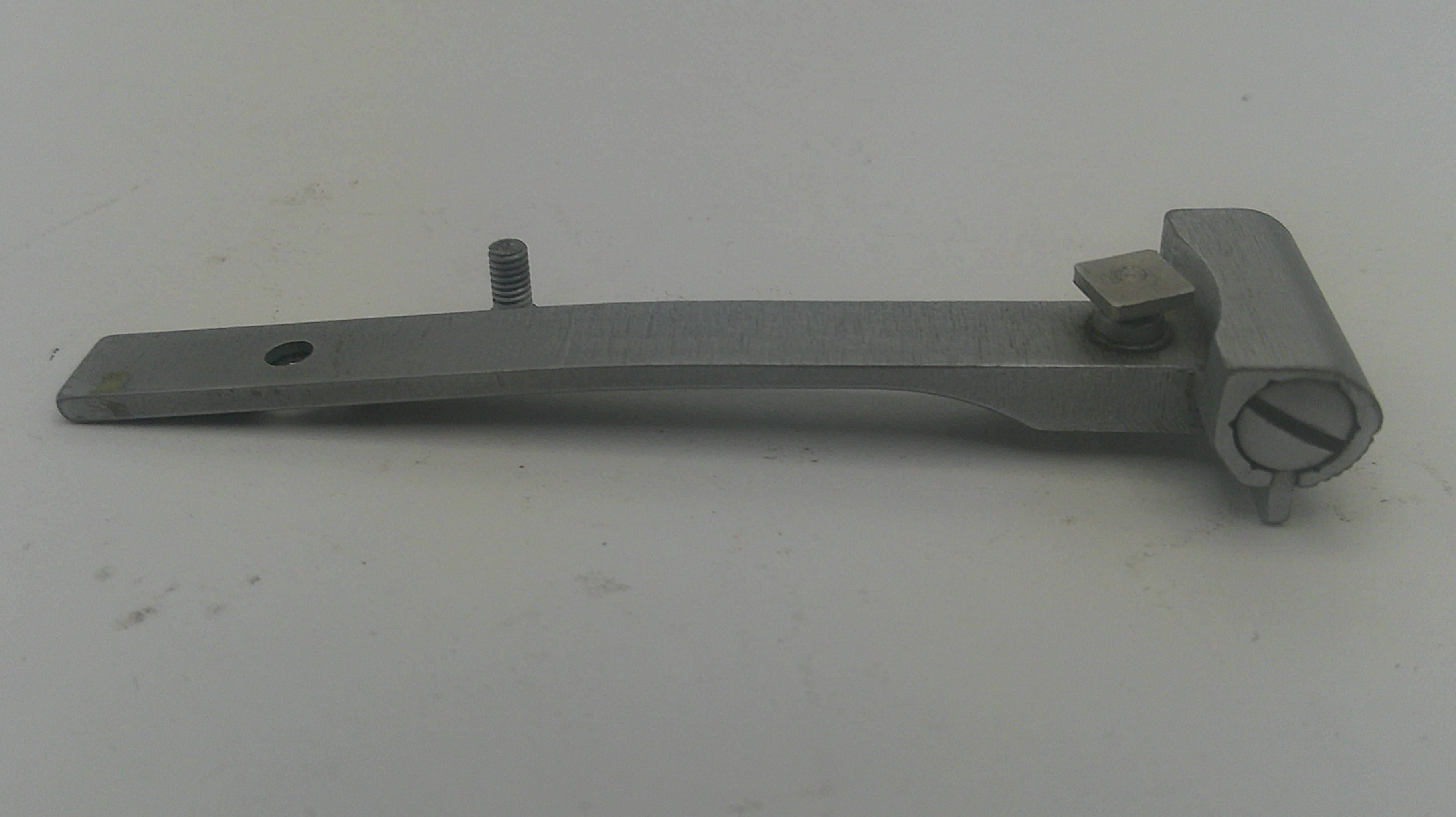 A metal window crank handle with a flat mounting plate, a threaded screw, and a square adjustment knob, shown on a plain light gray background.
