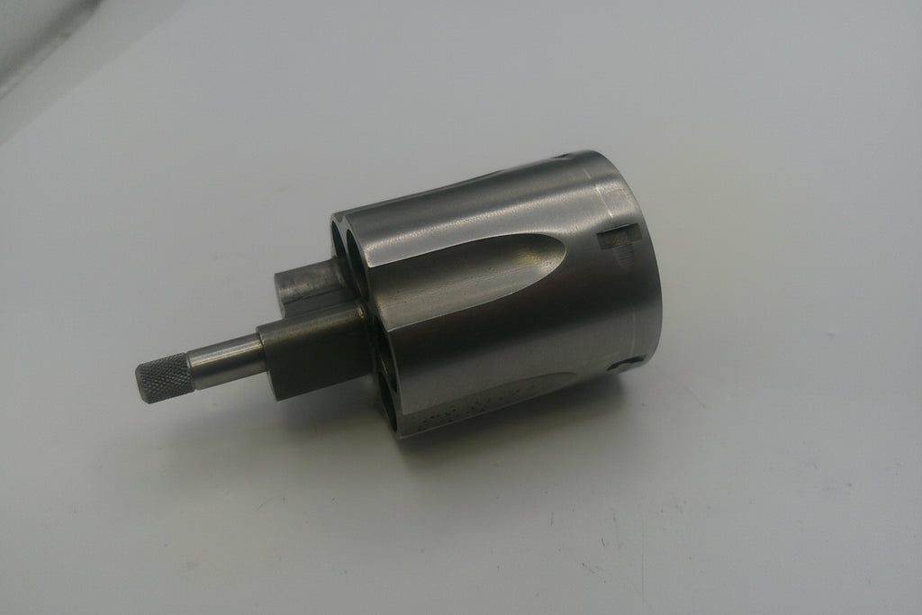 Metal drill bit on a white surface
